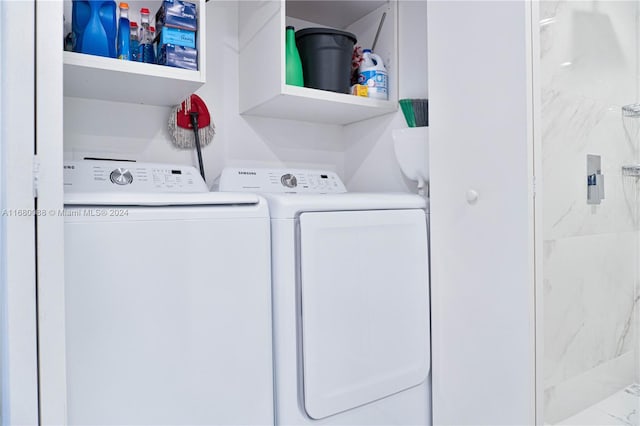 washroom with washing machine and dryer