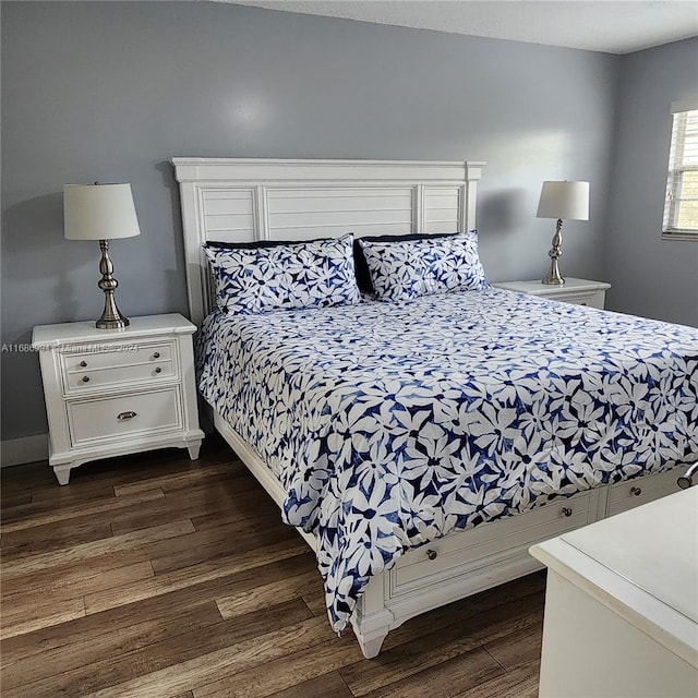 bedroom featuring dark hardwood / wood-style flooring