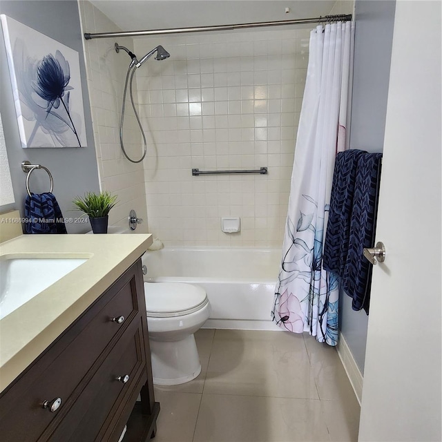 full bathroom featuring tile patterned flooring, vanity, shower / bath combination with curtain, and toilet