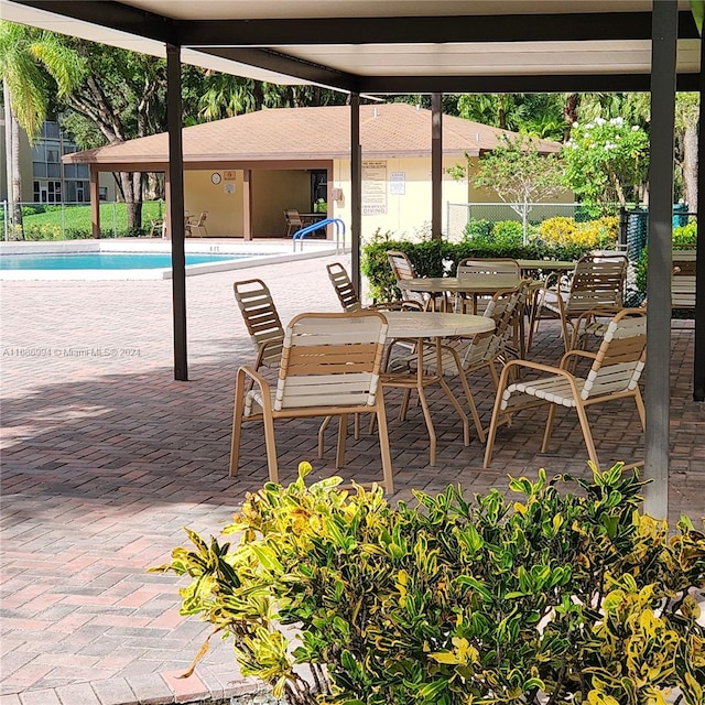 view of patio with a community pool