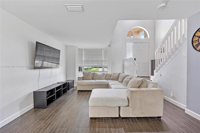 living room featuring dark wood-type flooring