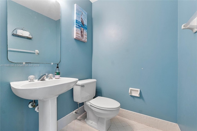 bathroom with tile patterned floors and toilet