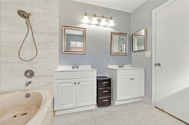 bathroom featuring vanity and tiled shower / bath