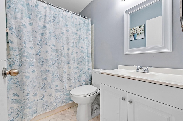 bathroom featuring vanity, walk in shower, tile patterned flooring, and toilet