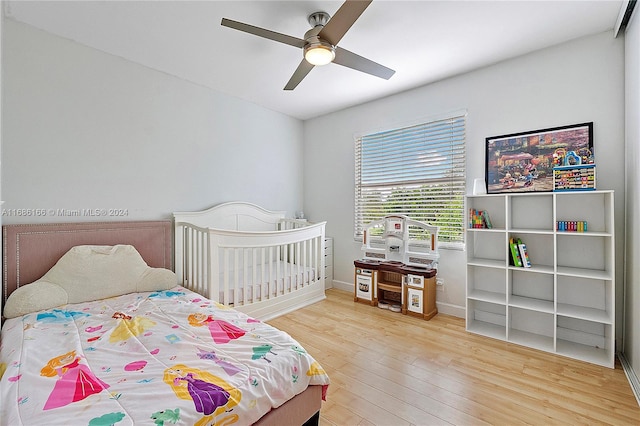 bedroom with hardwood / wood-style flooring and ceiling fan