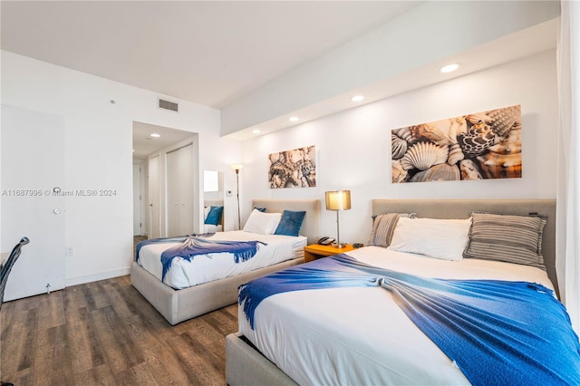 bedroom featuring dark hardwood / wood-style flooring