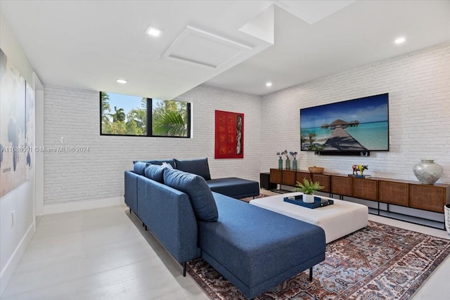 living room featuring brick wall