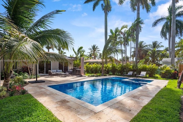 view of swimming pool with a patio and an outdoor hangout area