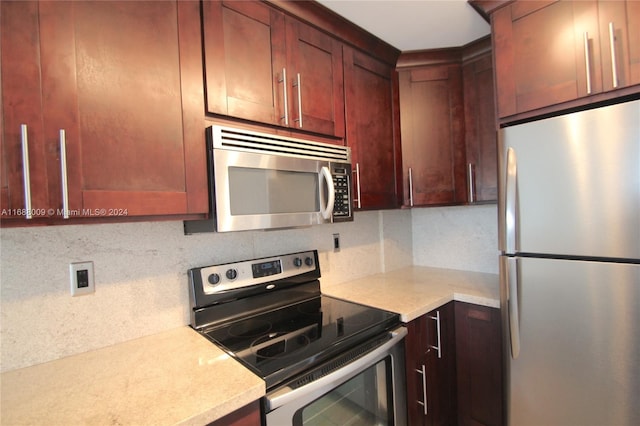 kitchen featuring decorative backsplash and stainless steel appliances