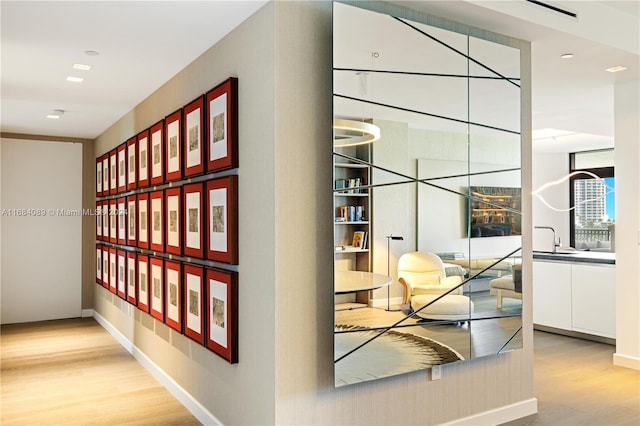 7065 Fisher Island Dr Unit 7065, Miami Beach, FL 33109 - hall with wood finished floors, baseboards, and recessed lighting