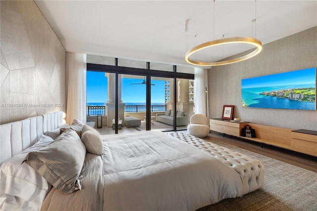 7065 Fisher Island Dr Unit 7065, Miami Beach, FL 33109 - bedroom with access to exterior, wood finished floors, and floor to ceiling windows