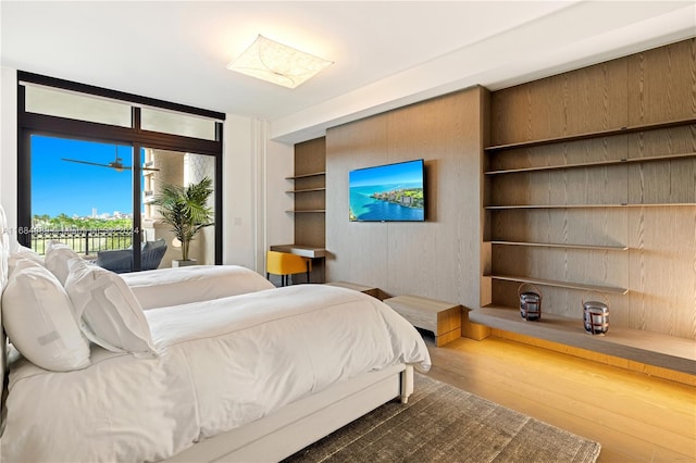 bedroom featuring dark wood-type flooring and access to outside