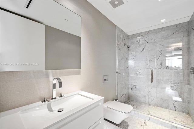7065 Fisher Island Dr Unit 7065, Miami Beach, FL 33109 - bathroom featuring toilet, a marble finish shower, marble finish flooring, and vanity