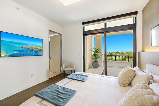 bedroom with dark wood-type flooring and access to exterior