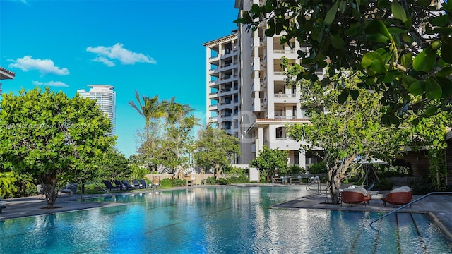 view of pool with a water view