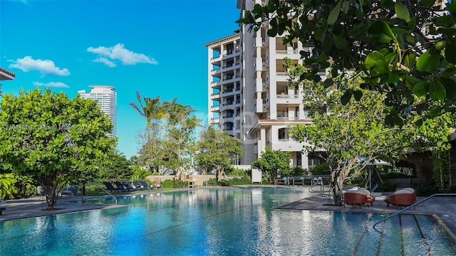 7065 Fisher Island Dr Unit 7065, Miami Beach, FL 33109 - community pool featuring a patio