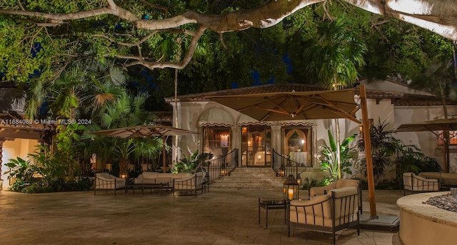 7065 Fisher Island Dr Unit 7065, Miami Beach, FL 33109 - patio at twilight with an outdoor hangout area