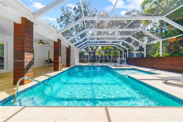 view of pool featuring a patio area, a lanai, and ceiling fan