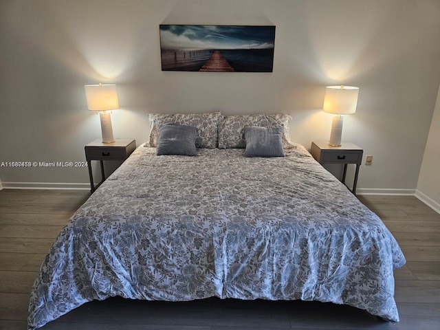 bedroom featuring dark wood-type flooring