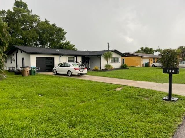 ranch-style home with a garage and a front yard