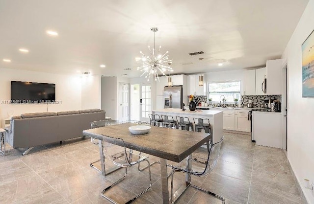 dining space with a notable chandelier