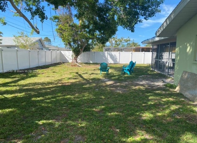 view of yard featuring a sunroom