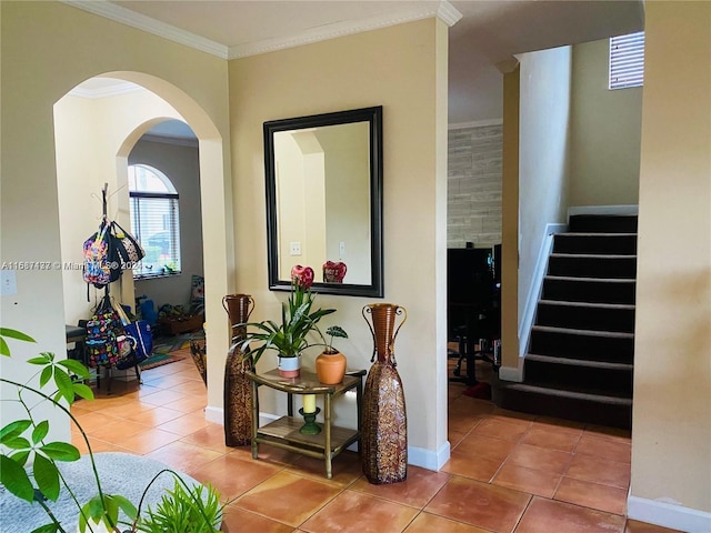 hallway with tile patterned flooring and crown molding