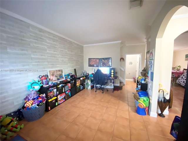 playroom featuring tile patterned floors and ornamental molding