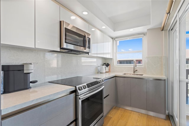 180 NE 12th Ave Unit 12E, Hallandale Beach, FL 33009 - kitchen featuring appliances with stainless steel finishes, modern cabinets, a sink, and recessed lighting