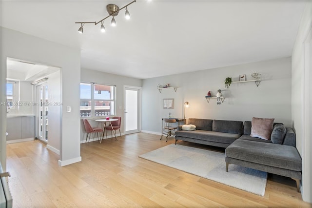 180 NE 12th Ave Unit 12E, Hallandale Beach, FL 33009 - living area featuring light wood-type flooring and baseboards