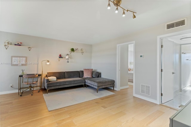 180 NE 12th Ave Unit 12E, Hallandale Beach, FL 33009 - living area featuring light wood finished floors and baseboards