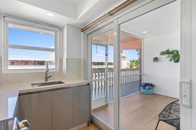 180 NE 12th Ave Unit 12E, Hallandale Beach, FL 33009 - interior space with a sink, healthy amount of natural light, recessed lighting, and light wood finished floors