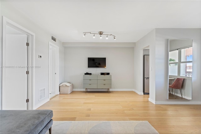 180 NE 12th Ave Unit 12E, Hallandale Beach, FL 33009 - living area featuring light wood-style floors and baseboards