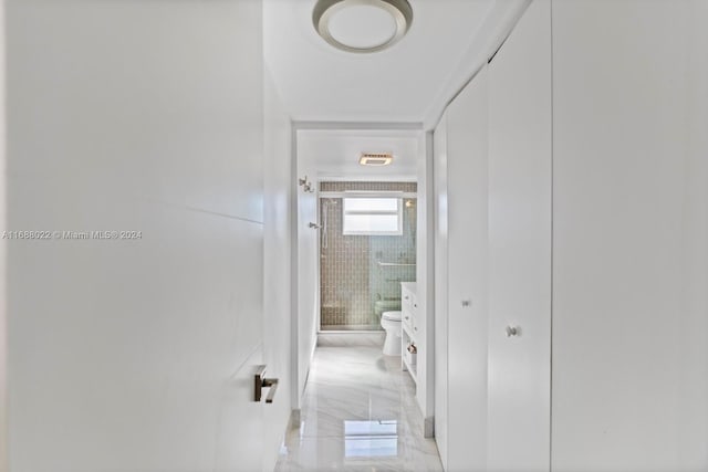 180 NE 12th Ave Unit 12E, Hallandale Beach, FL 33009 - corridor featuring tile walls