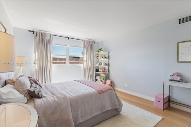 180 NE 12th Ave Unit 12E, Hallandale Beach, FL 33009 - bedroom featuring light wood-style floors and baseboards