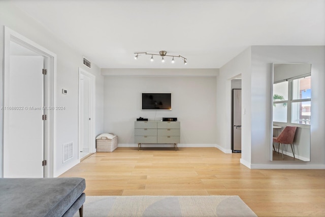 180 NE 12th Ave Unit 12E, Hallandale Beach, FL 33009 - living area featuring light wood-style floors and baseboards