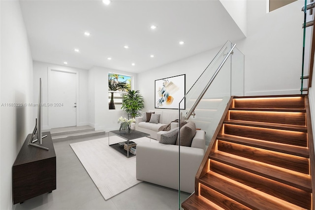 living room featuring concrete flooring