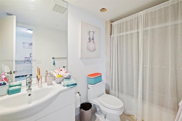 full bathroom with tile patterned flooring, vanity, toilet, and shower / tub combo with curtain