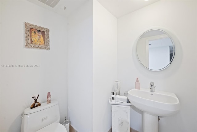 bathroom with sink and toilet