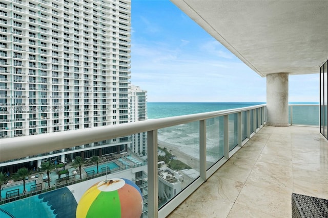 balcony featuring a water view