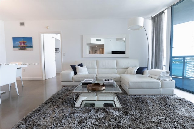 living room featuring concrete flooring