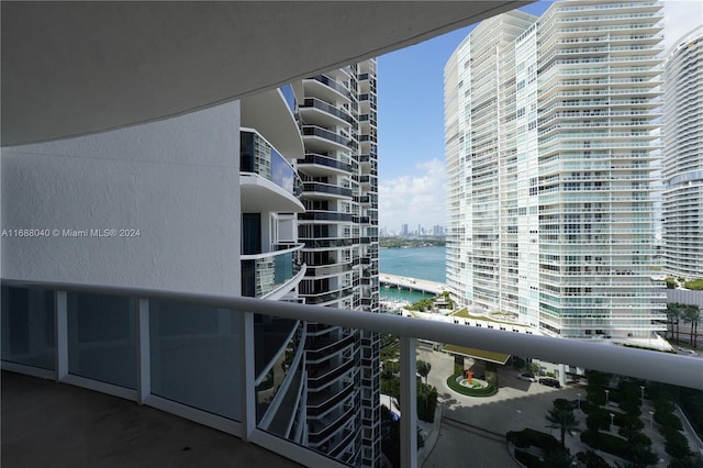 balcony featuring a water view