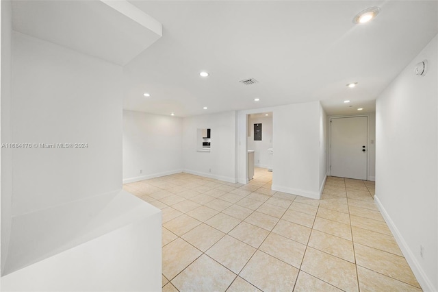 tiled spare room with electric panel