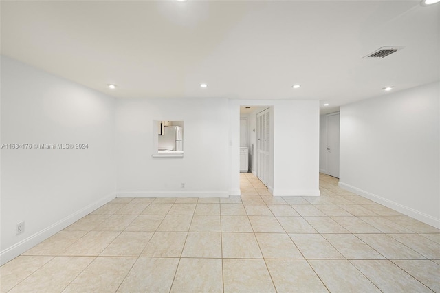 unfurnished room with light tile patterned floors