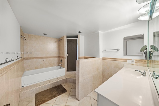 bathroom featuring tile walls, vanity, and tile patterned floors