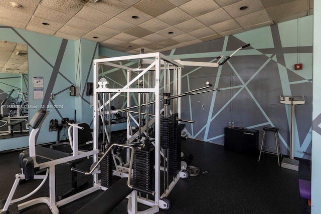 exercise room with a drop ceiling