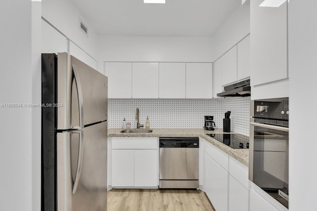 kitchen featuring white cabinetry, light hardwood / wood-style floors, stainless steel appliances, and sink