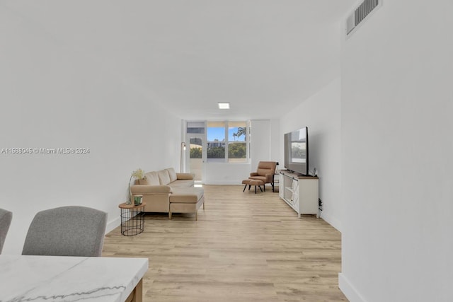 living room with light hardwood / wood-style floors