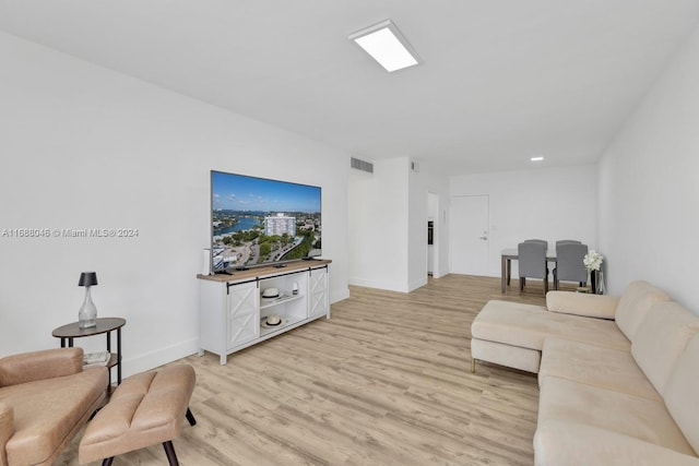 living room with light hardwood / wood-style flooring