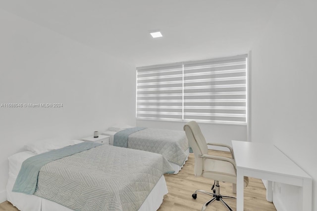 bedroom featuring hardwood / wood-style flooring